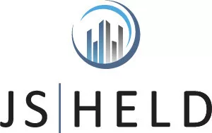 JS Held logo featuring a stylized blue and gray circular design with skyscraper silhouettes, accompanied by the company name in bold uppercase letters.