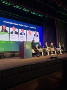A panel of industry experts discusses reinsurance strategies during the Zywave Cyber Risk Insights Conference in New York, focusing on cyber insurance market trends and cybersecurity resilience.
