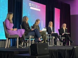 Panel of attorneys and insurance claims experts discussing cyber litigation and data breach class actions during the PLUS Cyber Symposium cyber liability insurance conference.