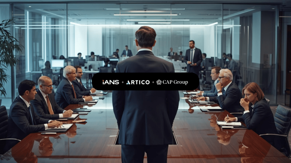 CISO standing at the end of a modern boardroom table, addressing engaged directors during a cyber risk briefing, with office staff visible through glass walls.